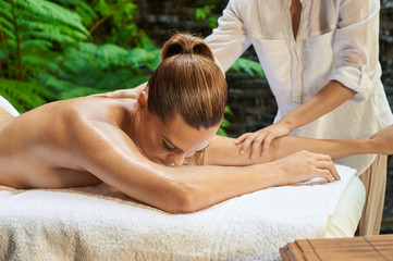 Obraz na płótnie Canvas asian back massage theraphy spa hot stone