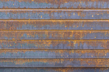 The rectangle tube,The rectangle tube stack with the rusty in the construction site.Close-up of the rusty steel tube in the construction site.The corrosion on the steel tube make the rusty.