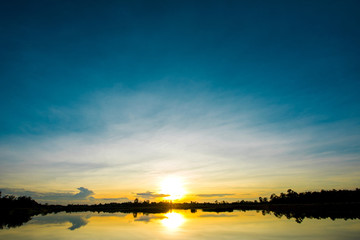 Fototapeta premium Beautiful sunset at the wetland, Breathtaking sunset with blue sky