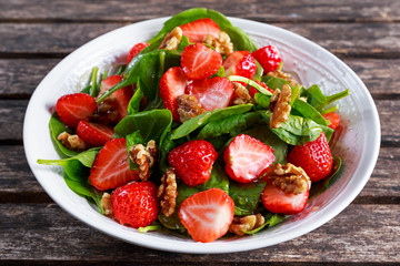 Summer Fruit Vegan Spinach Strawberry nuts Salad. concepts health food