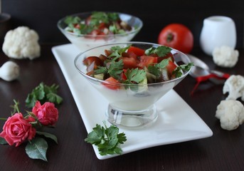 Panna Cotta with cauliflower salad with tomato and basil