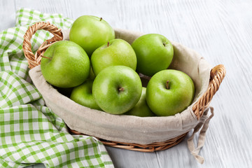 Green apples in basket