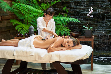 asian back massage theraphy spa hot stone