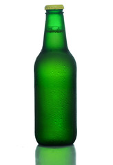 Green bottle of cold beer isoalted on white.