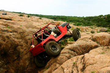 Red Jeep 4x4 rock crawling
