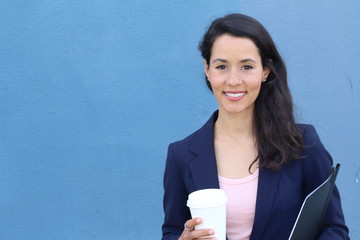 Nice female student smiling and looking at camera with copy space