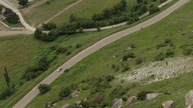 car passes under a mountain