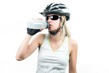 Cyclist drinking a energy sport drink from plastic bottle. Concept Winning in sports. Isolated on white background