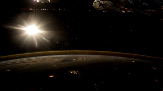 Sunrise and Earth seen from the ISS. Elements of this video furnished by NASA.