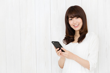 portrait of attractive asian woman on wood background