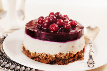 cake with cranberry jelly cream round shape berries closeup