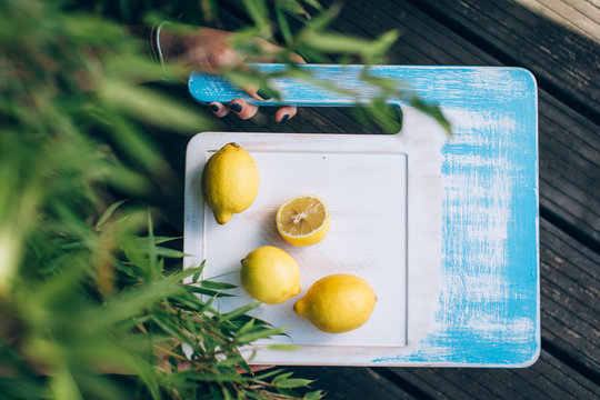Lemons on wooden board