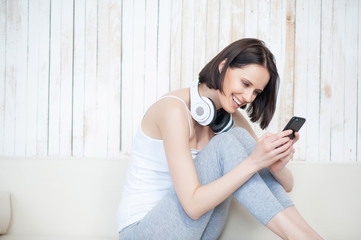 Smiling woman using cellphone