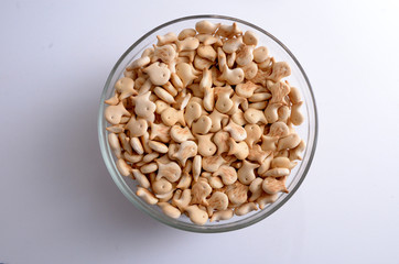 Transparent bowl of saltine crackers in the form of fish