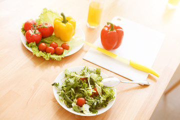 Mother and daughter making salad