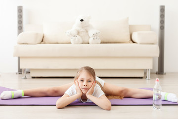 Little girl practicing yoga