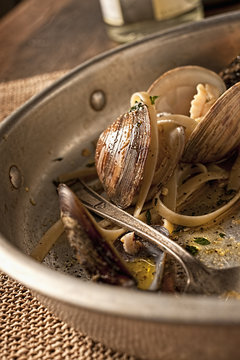 Close up of a leftover dish of seafood pasta