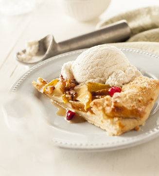 Individual portion of fruit galette with ice cream