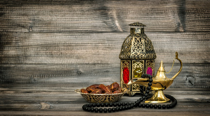 Fototapeta na wymiar Arabic lantern islamic rosary beads decoration vintage toned