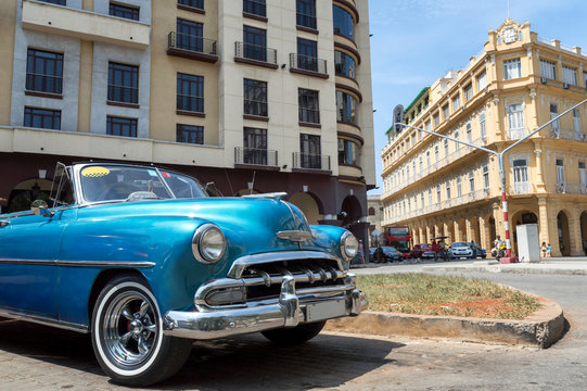 Blue american classic car on Parque Central in Havana, Cuba