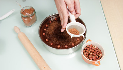 Hand decorating cake elevated view