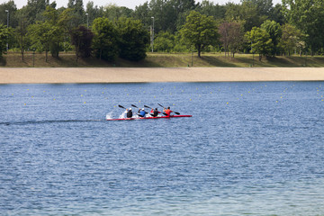 Four athlete in a kayak