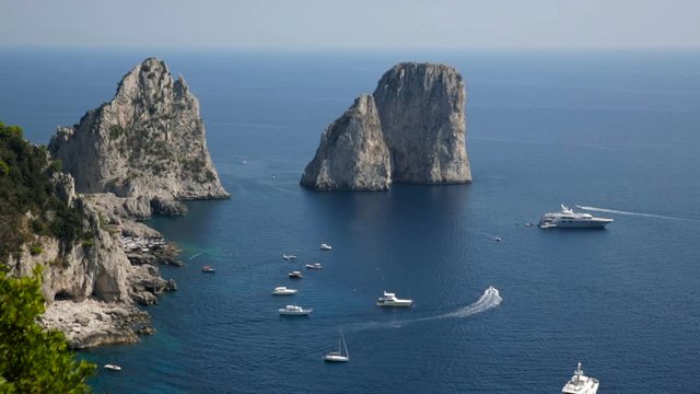 Faraglioni rock formation in the southern coastline of Capri, Italy