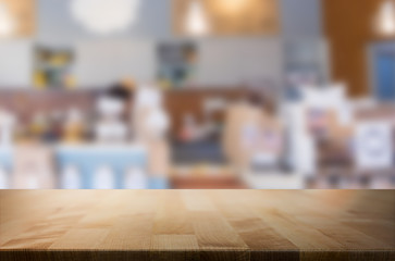Selected focus empty brown wooden table and space of Coffee shop