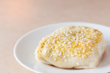 Pie topping sesame serve on white disk for breakfast.