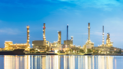 High resolution panorama oil refinery plant at dusk.