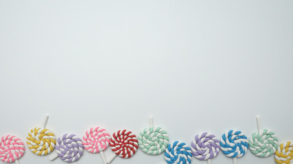 Colorful plastic lollipops toy with copy space
