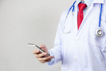 Doctor using phone in white isolated background