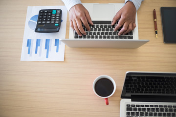 business man working on the laptop at office with copyspace