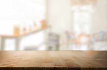 Selected focus empty brown wooden table and space of Coffee shop
