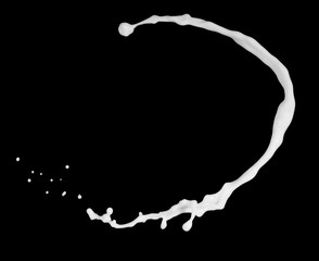 Milk splashes isolated on black background