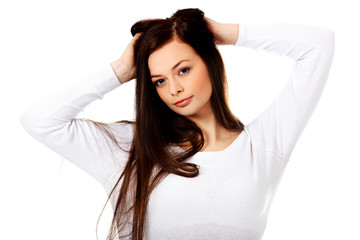 Naklejka premium Young beautiful woman massaging her own hairs