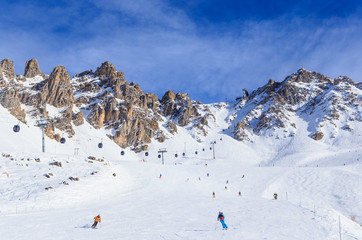 Fototapeta na wymiar Skiers on the slopes of the ski resort of Meribel, France