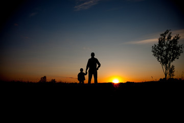 Fototapeta premium Father and son looking for future, silhouette concept
