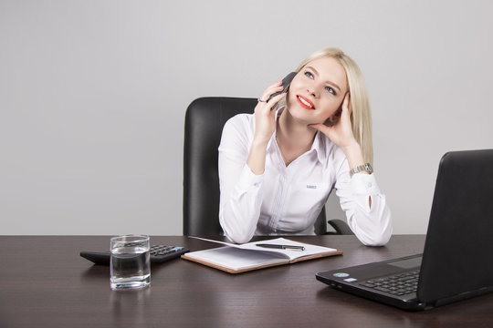 woman businessman on workplace in office talking on the phone
