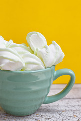 Peppermint large marshmallows in a big green cup