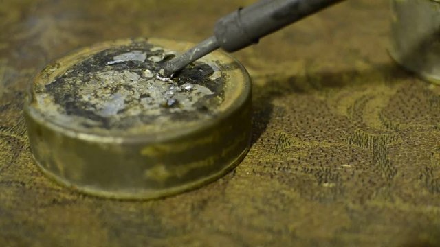 Soldering tin melts