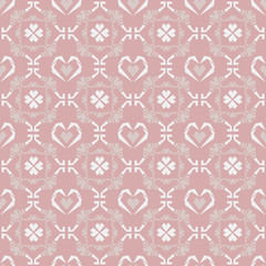 Seamless doodle heart pattern in pink background