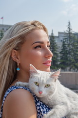 Beautiful girl with white cat