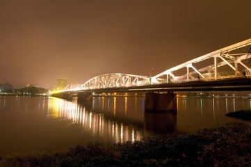 Trang Tien Bridge at night, Hue, Vietnam. Trang Tien Bridge is the most beautiful bridge in Hue in...
