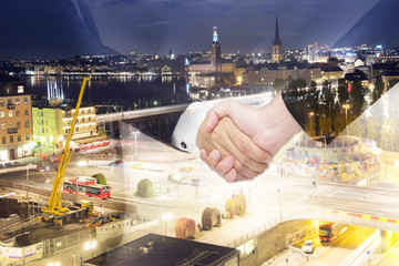 Teamwork for success of the business in the future. Double Exposure of handshake.