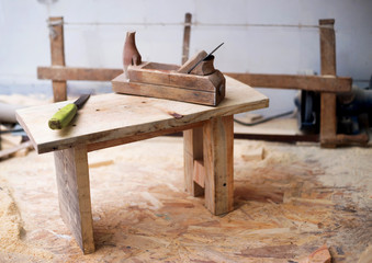 Carpenter tools on wood table background. Copy space