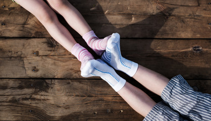 Closeup photo of family feet in colorful socks
