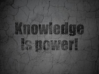 Learning concept: Knowledge Is power! on grunge wall background