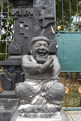 Smiling god stone statue in Bali　_ Thumb up