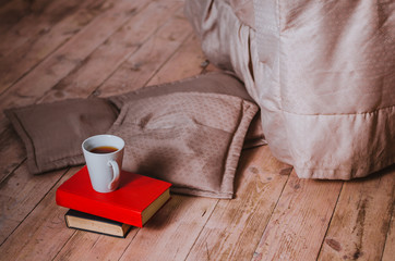 on the floor are bright dereayannom tosltye books on them is a w